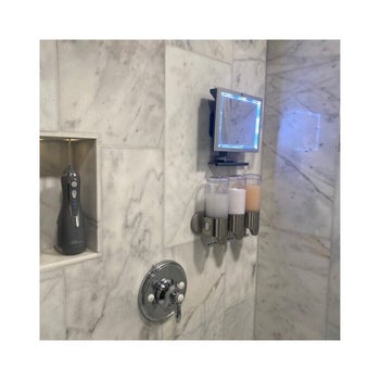reviewer photo of lighted mirror mounted in a shower
