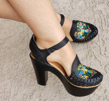model feet wearing black huarache sandals