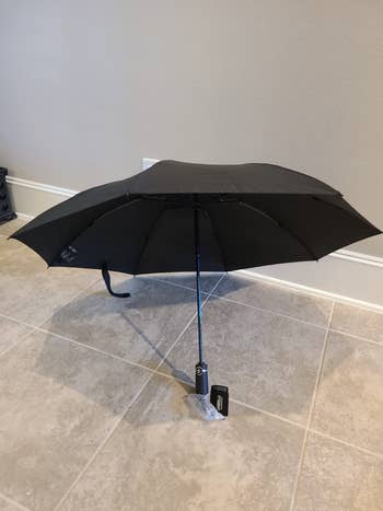 another reviewer's open black umbrella