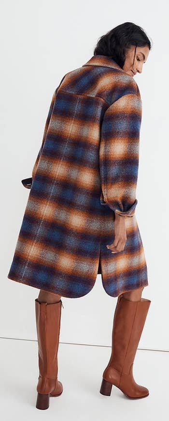 A different model showing the back of the ombré plaid jacket