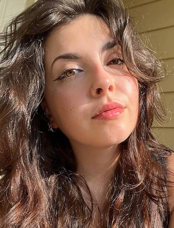 reviewer with glowing skin in the sun