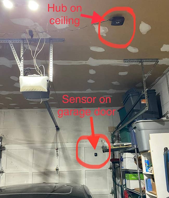 a reviewer photo of a garage interior with the door sensor mounted on the door, and the hub mounted on the ceiling 
