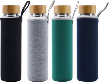 the four water bottles with different colored sleeves: black, grey, green, blue
