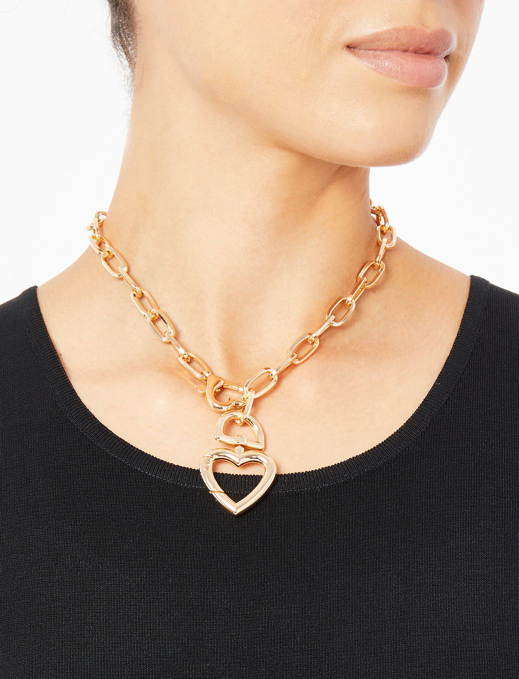 model wearing the gold heart necklace 