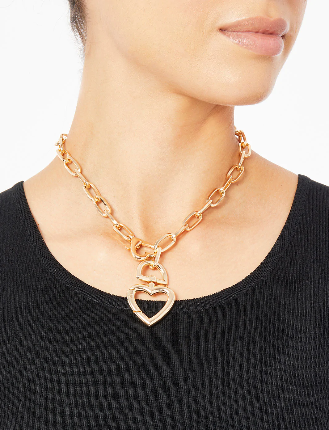 model wearing the gold heart necklace
