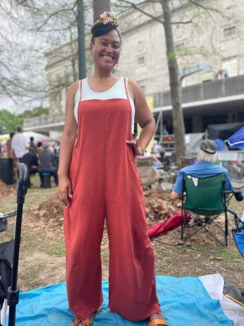reviewer wearing the jumpsuit in red