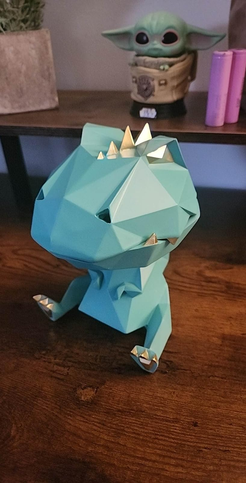 a reviewer photo of a dinosaur figurine 