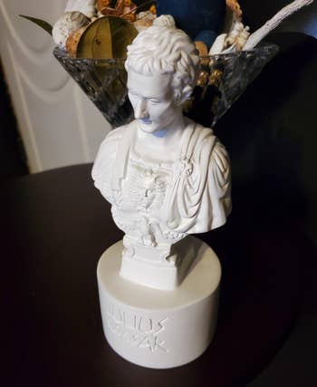 closeup of reviewer's bust pencil holder from the front