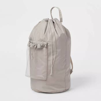 the gray laundry backpack with a mesh pocket