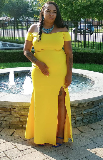 reviewer in the long yellow dress