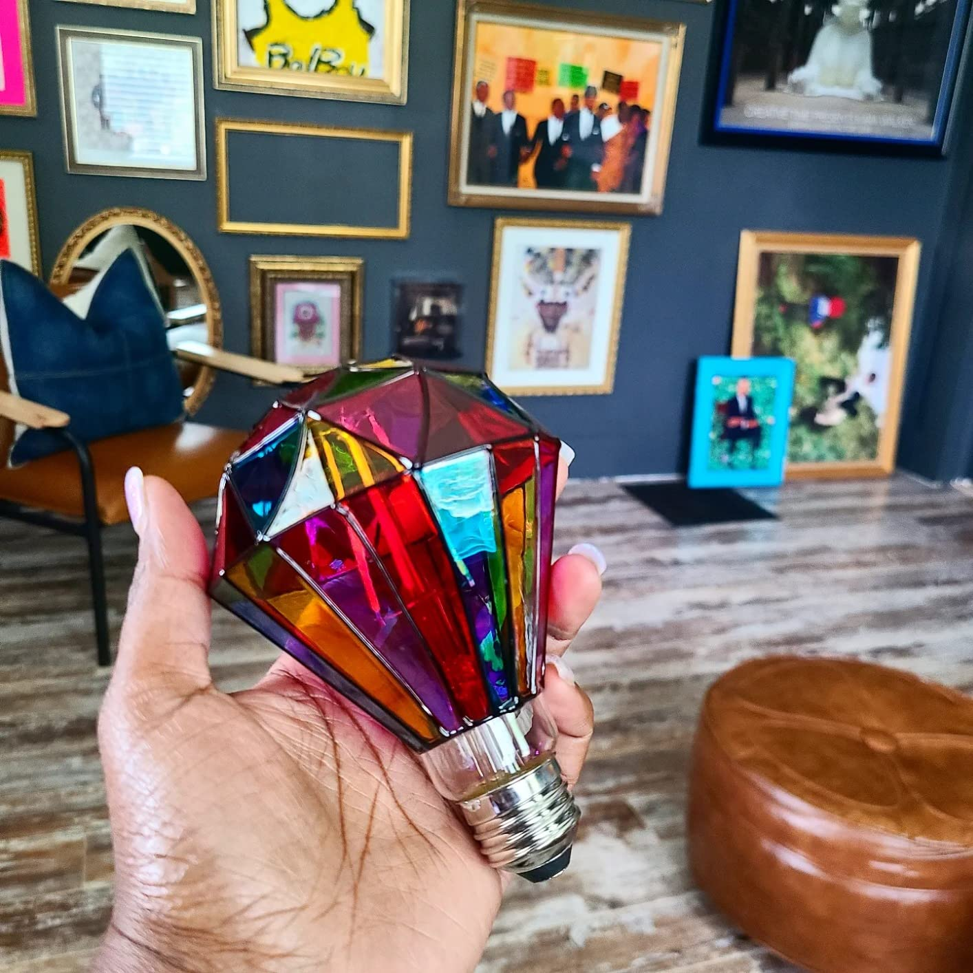 a reviewer holding the diamond-shaped bulb