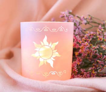 pink jar with tangled sun engraving
