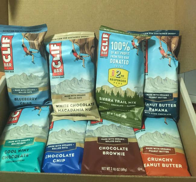 reviewer's box of bars including cool mint chocolate, crunchy peanut butter, sierra trail mix, and chocolate brownie