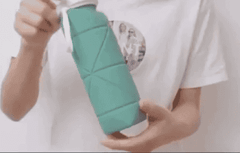 Lifestyle A gif of the turquoise water bottle being collapsed