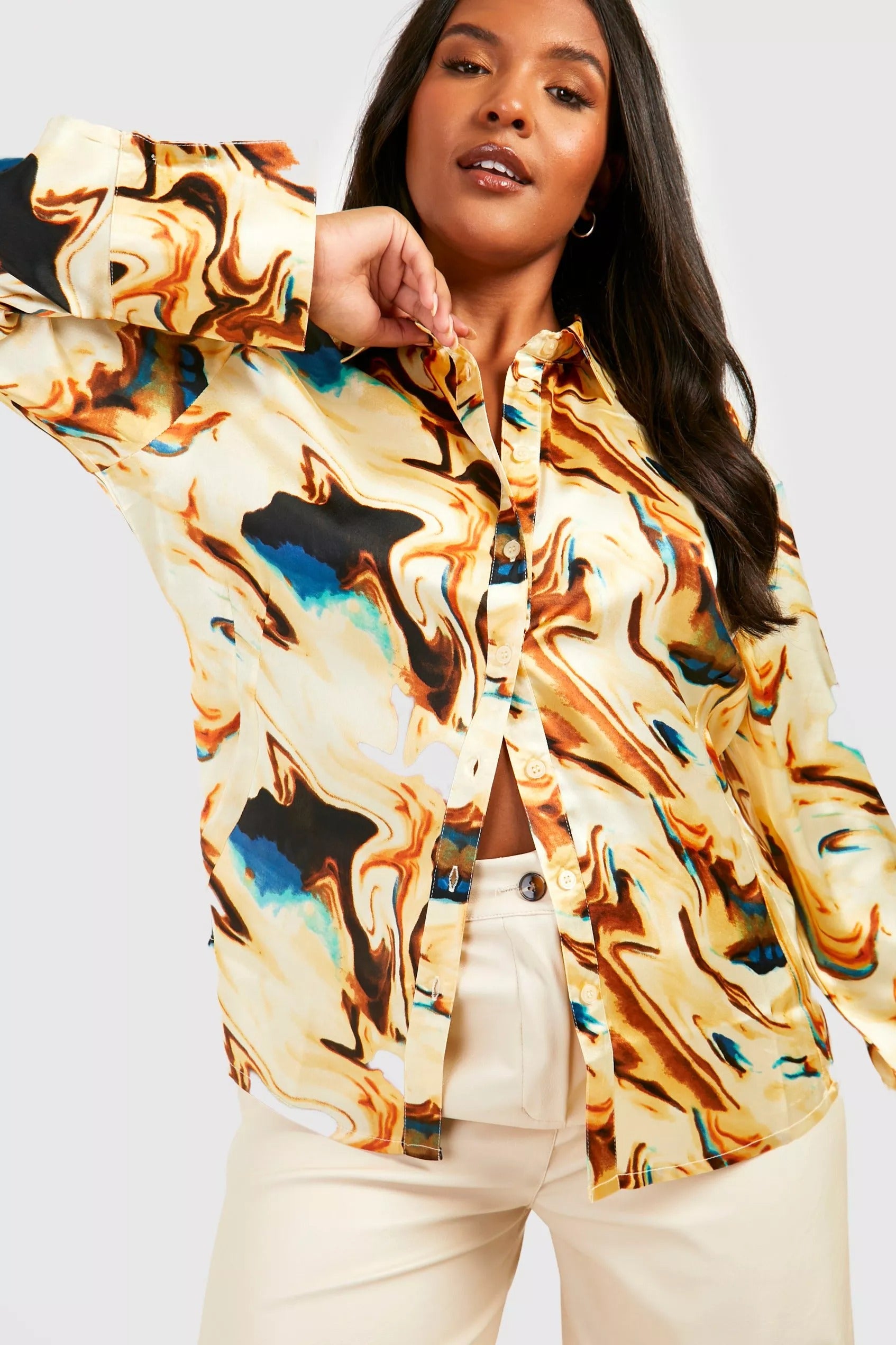 a model wearing the marble satin blouse