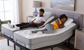 couple sleeping on split king adjustable bed