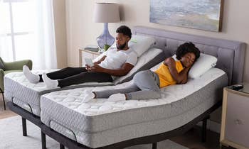 couple sleeping on split king adjustable bed