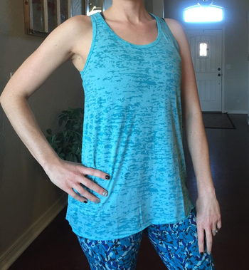 Image of reviewer wearing blue tank