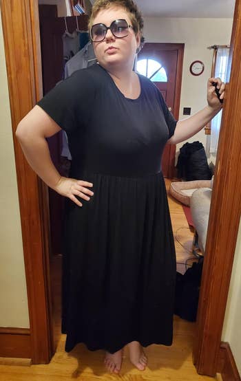 reviewer in black short sleeve tee dress