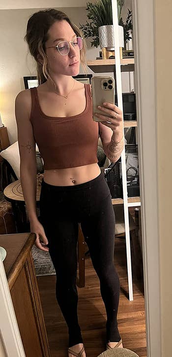 reviewer mirror selfie wearing brown workout crop top