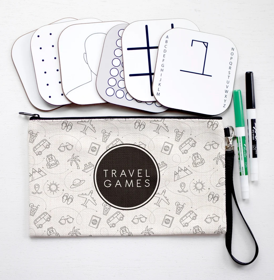 The Travel Games set, including dry-erase boards, markers, and a carrying case