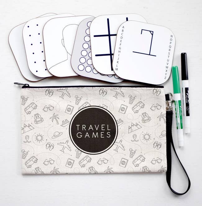 The Travel Games set, including dry-erase boards, markers, and a carrying case