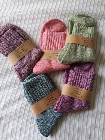 the set of five socks in purple, pink, green, blue, and red 