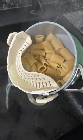 A pot with a clip-on strainer