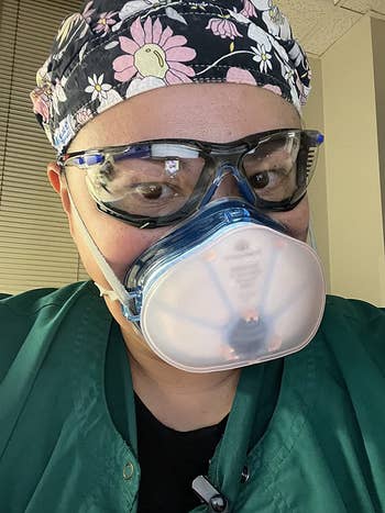 a reviewer wearing fog-free goggles and a face mask 