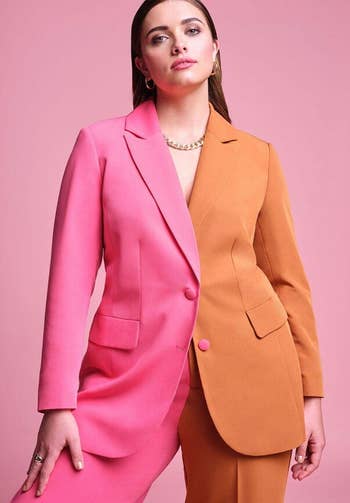 a model wearing the blazer in pink and orange 