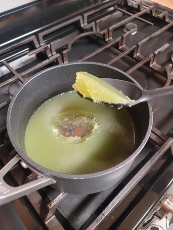 the same reviewer's pot after the oil has hardened and they are able to scoop it out of the pot