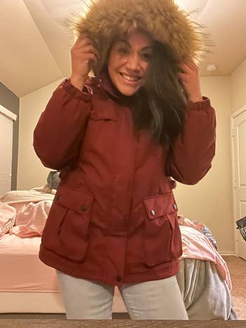 reviewer wearing the jacket in red