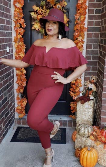 reviewer wearing the burgundy jumpsuit
