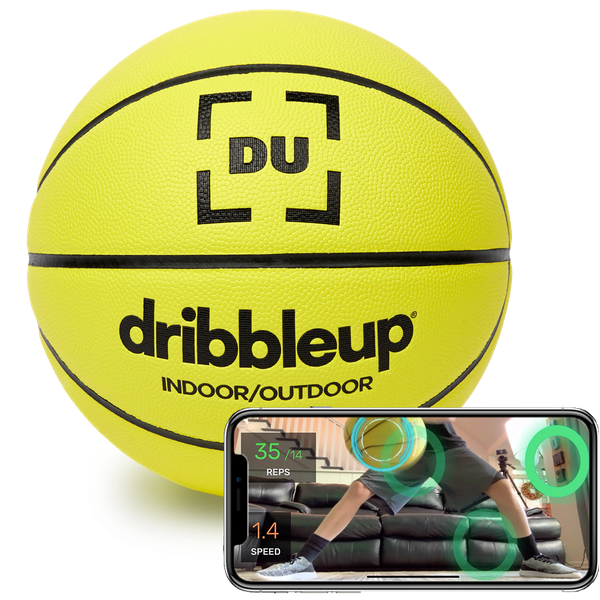 the smart yellow basketball next to phone with the DribbleUp app and dribble tracker on screen