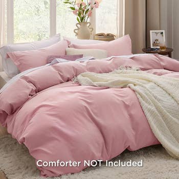 pink duvet set on a bed