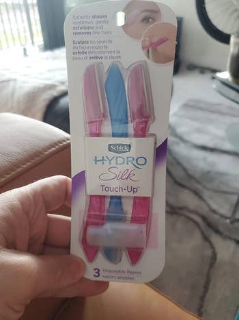 three pink and blue small blades in their packaging 