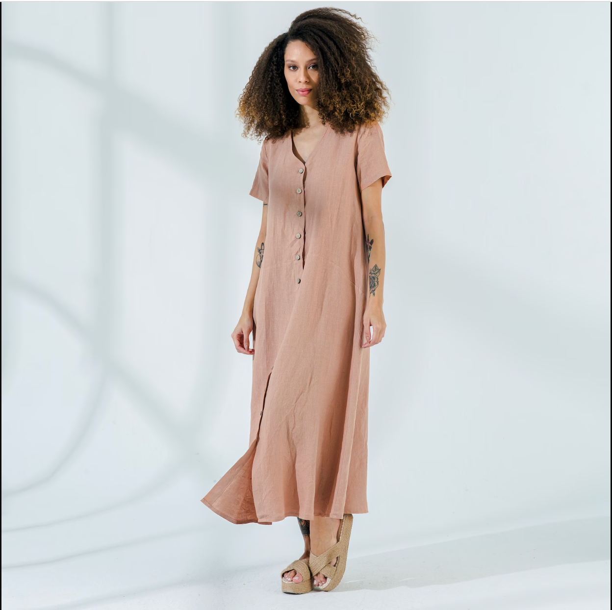 Model in beige button up short sleeve linen maxi dress
