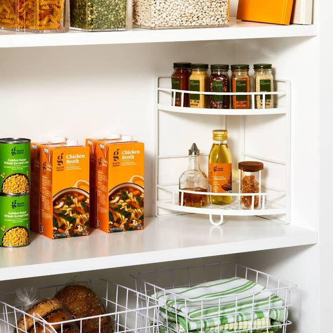 lifestyle image of white pantry corner shelf with spices