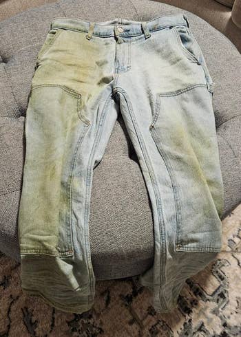 Work pants with disposable deterioration and tear, resting connected a cushioned surface. Ideal for rugged usage oregon casual style