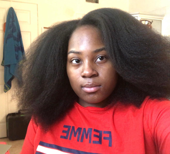 reviewer with medium length straightened hair