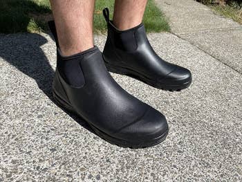 reviewer photo wearing black ankle slip-on rain boots