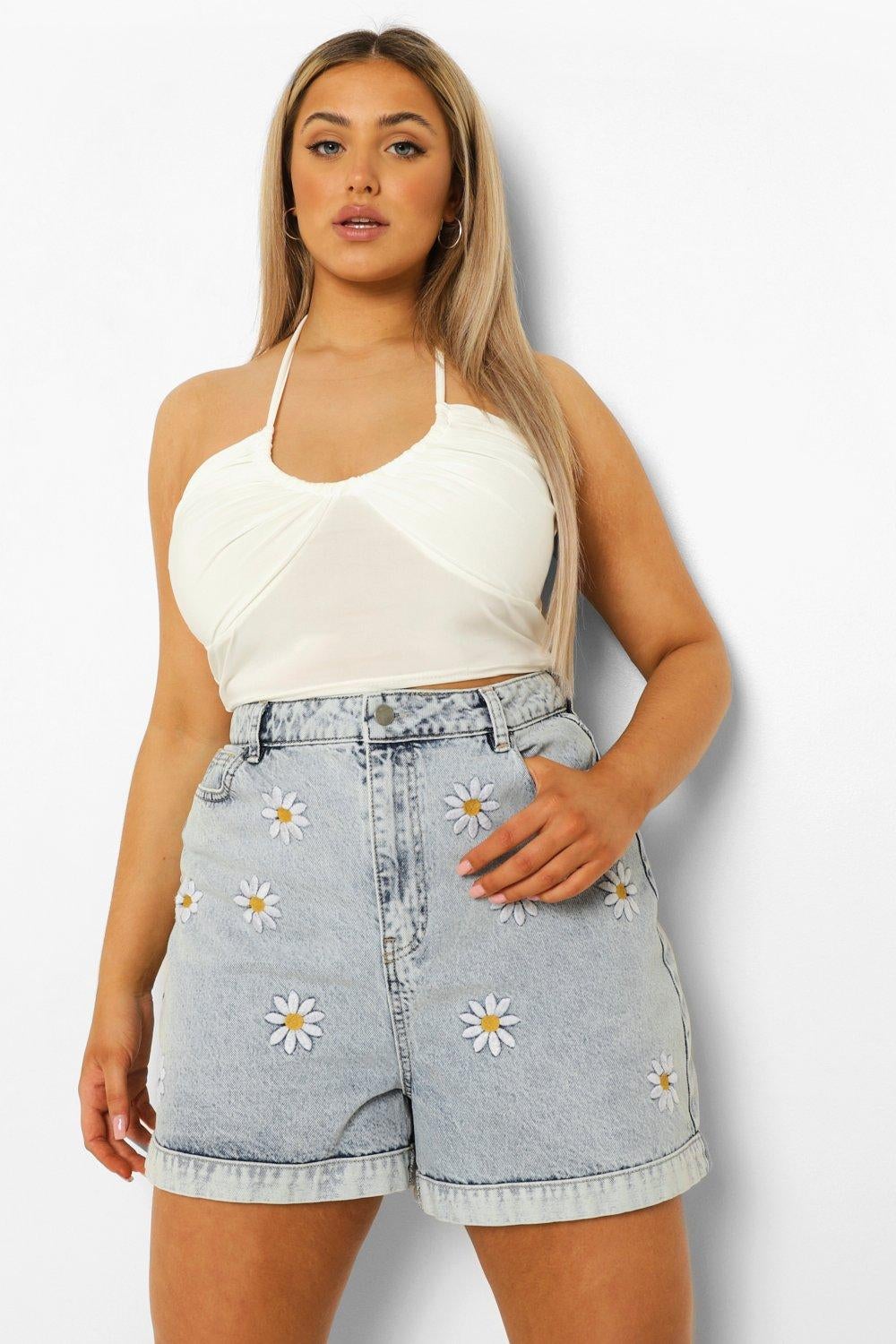 model wearing the light wash jean shorts