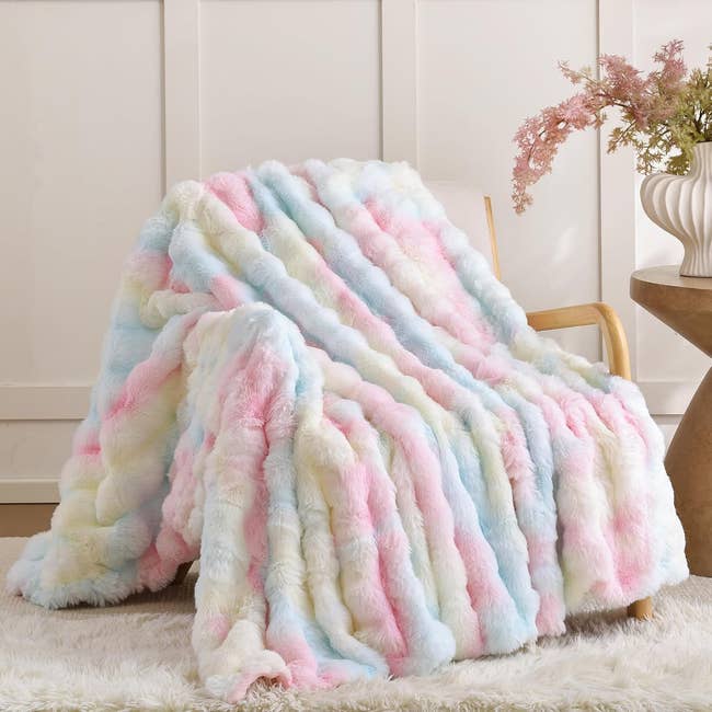 Plush faux fur propulsion  broad  draped implicit    a seat  adjacent   a tiny  circular  array  with flowers. Ideal for adding cozy texture to location  decor