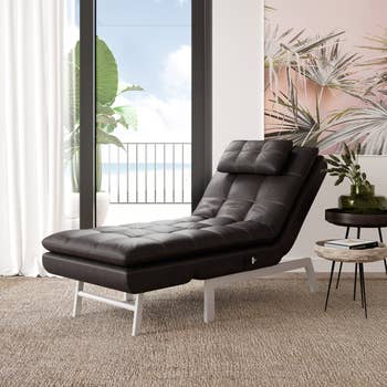 Image of brown faux leather lounge chair in reclined position