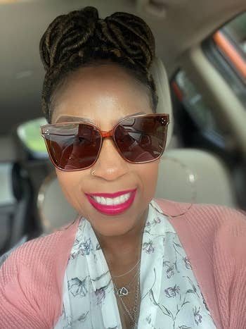 a reviewer wearing the jacinth oversized sunglasses