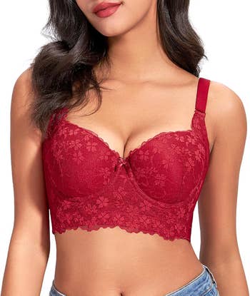 A pistillate models a lace bralette with a floral pattern, highlighting its acceptable and detail