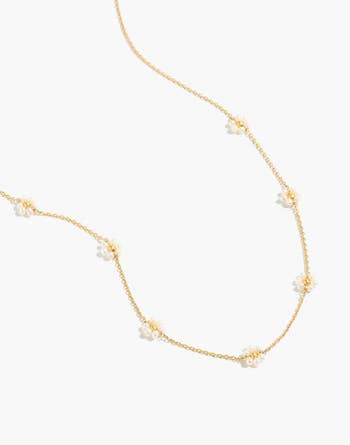 a freshwater pearl daisy choker with a gold chain