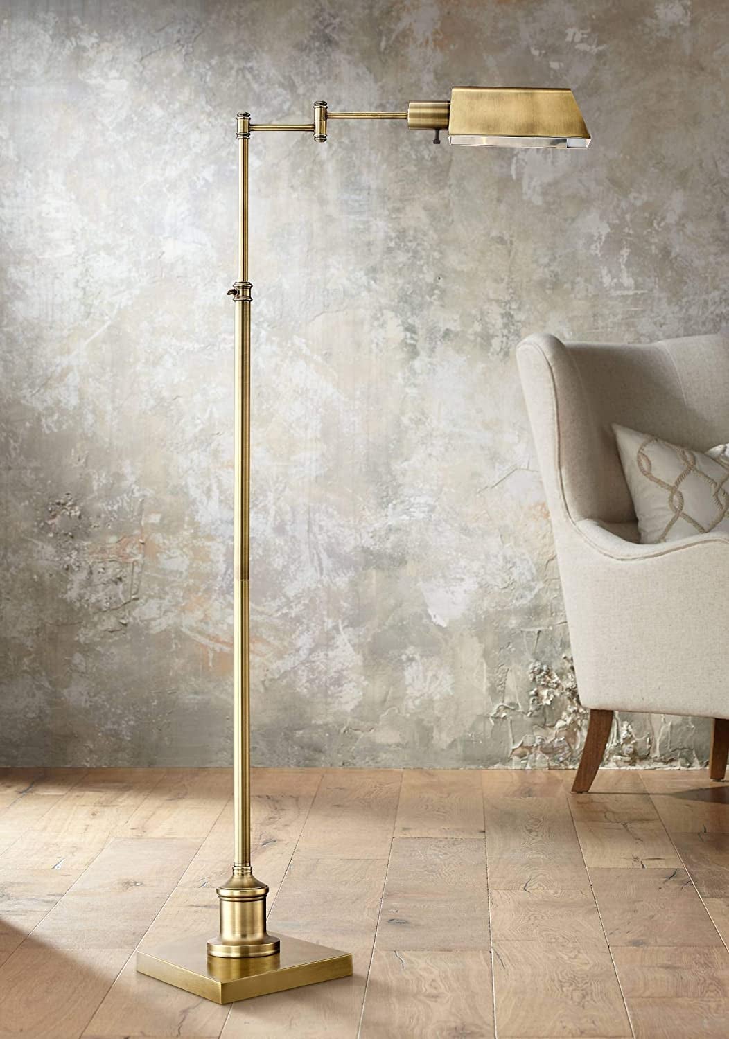 the gold floor lamp with an arm at a 90-degree angle
