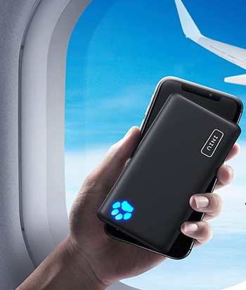A black charging bank connected to a phone