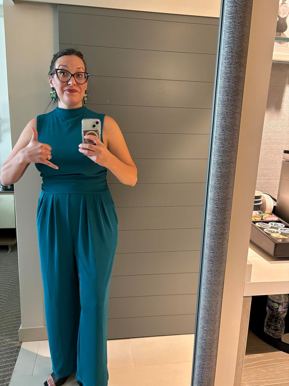 reviewer wearing the bluish  jumpsuit